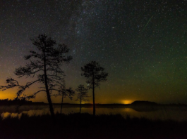 A Perseid meteor streaking over the Milky Way during a meteor shower