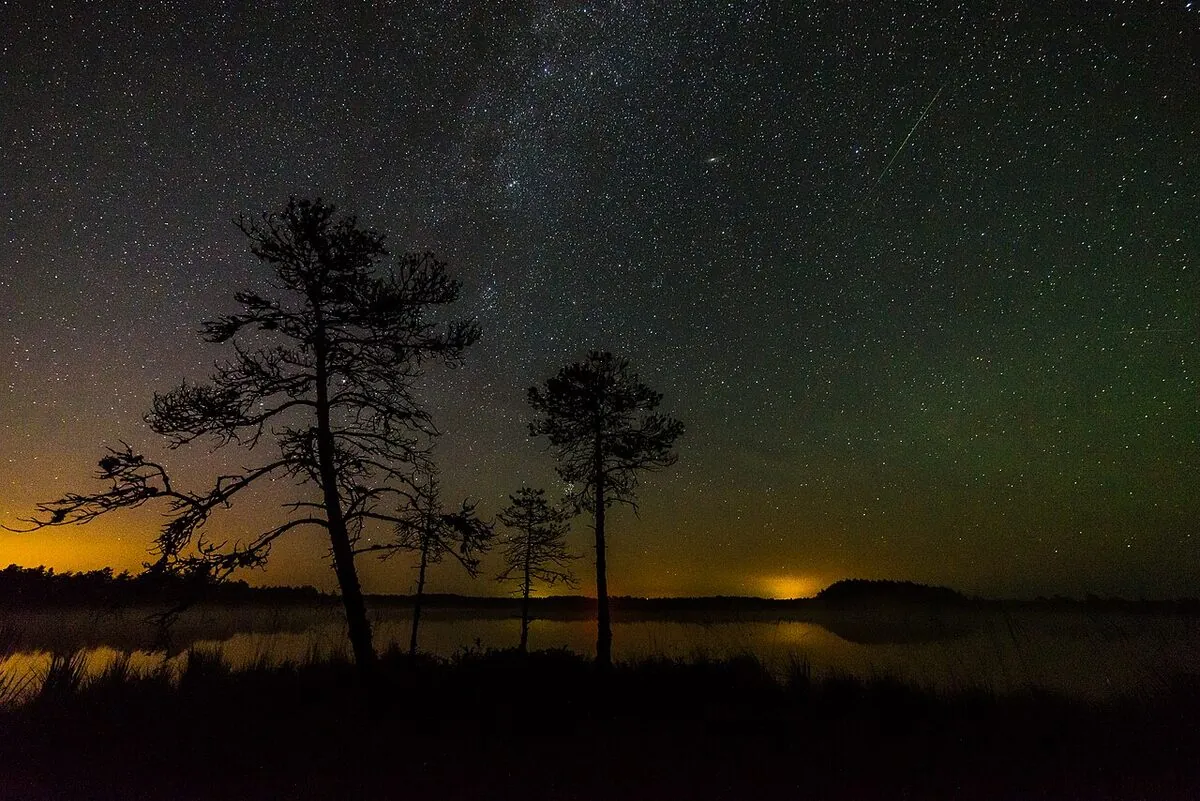 A Perseid meteor streaking over the Milky Way during a meteor shower A Perseid meteor streaking over the Milky Way during a meteor shower