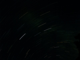 Long-exposure photograph of star trails circling the north celestial pole