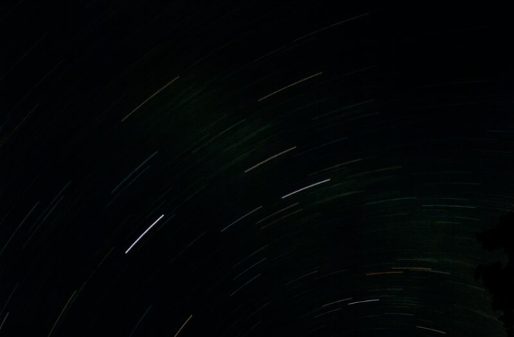 Long-exposure photograph of star trails circling the north celestial pole